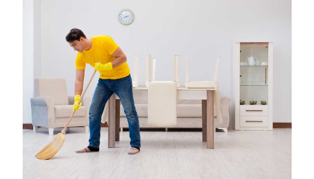 a man cleaning a room