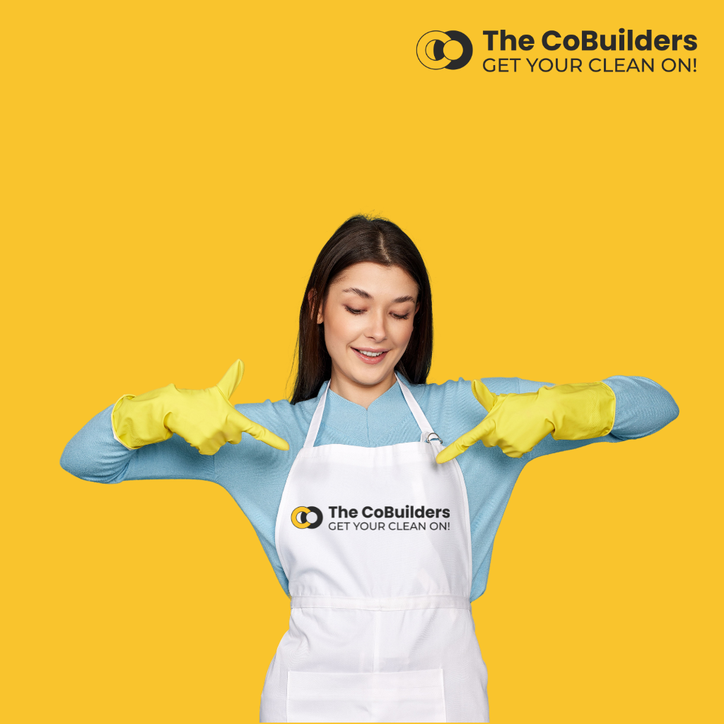 female house cleaner with a cobuilders logo on her apron